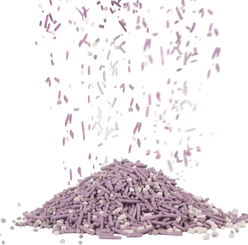 Purple and white sprinkles falling from above on a white background